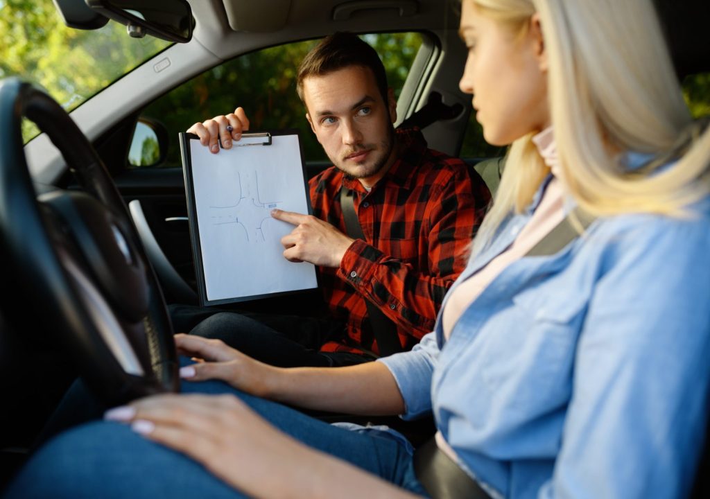 woman-and-man-with-checklist-driving-school-1-e1627375367962.jpg